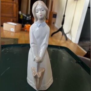 Porcelain Figurine with Umbrella